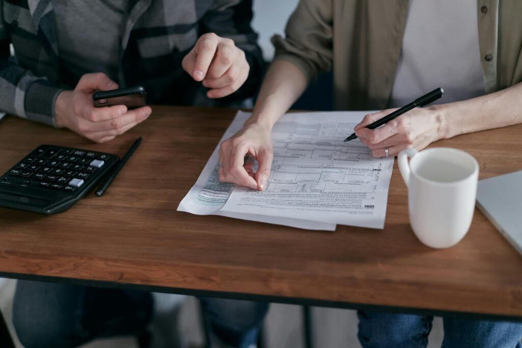 Couple managing joint bank account at home